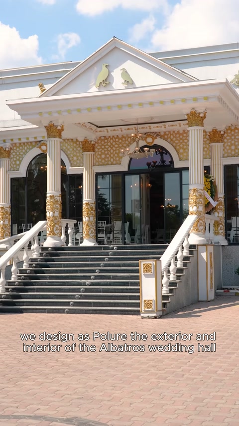 Golden-embellished columns and arched main entrance arrangement