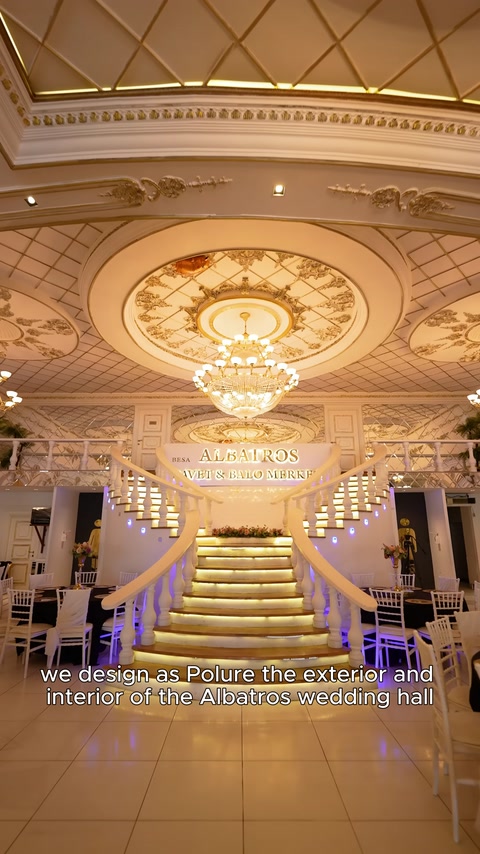 Entrance hall adorned with staircase, ceiling medallion, and cornices