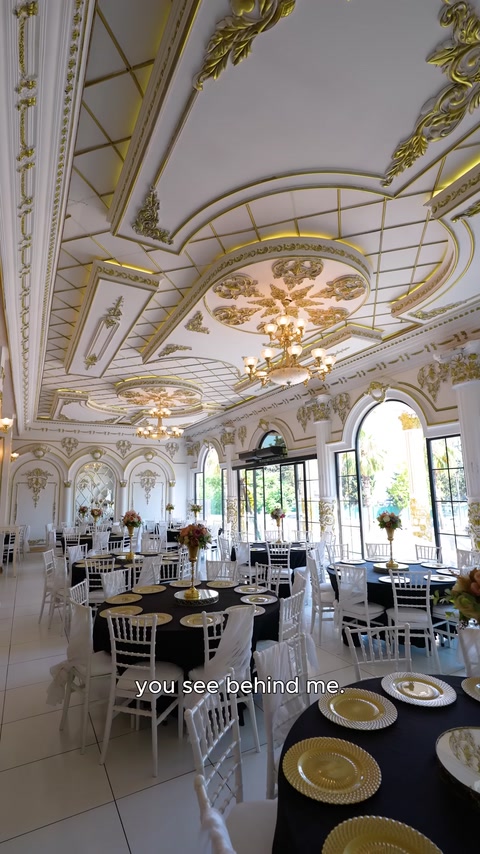 Hall featuring arched windows and decorative wall panels