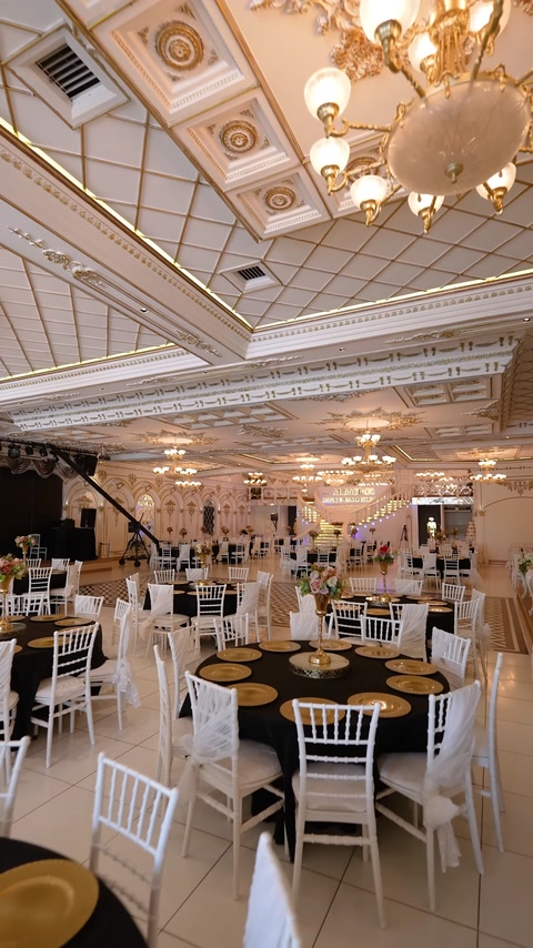 Spacious reception hall surrounded by cornices and ceiling moldings