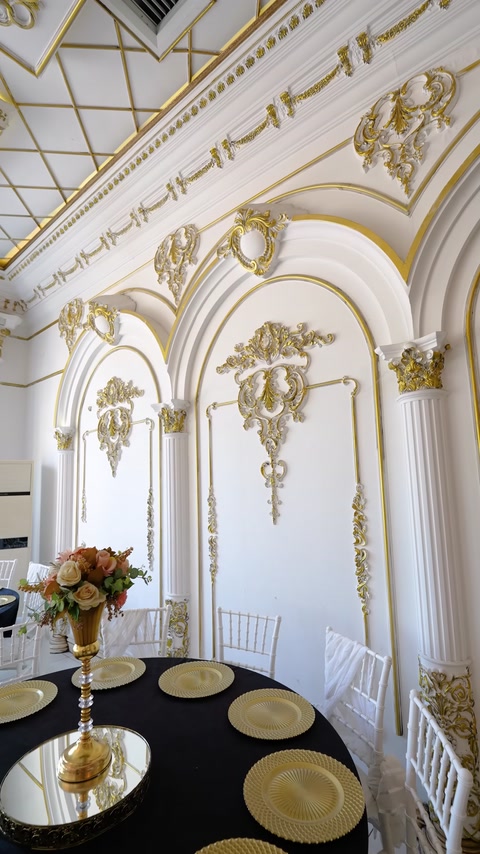 Decorative wall panels framed by columns and golden motifs
