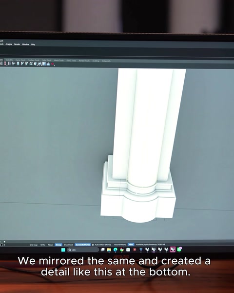 Mirrored lower detailing creates a balanced column and arcade composition