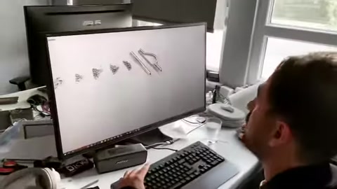 Various design drawings of decorative window profiles are visible on the screen.
