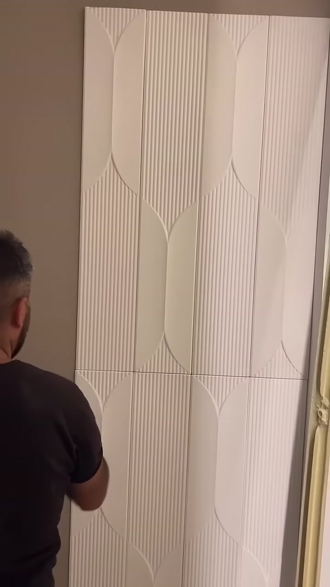 The joined panels create a continuous geometric striped pattern on the wall.