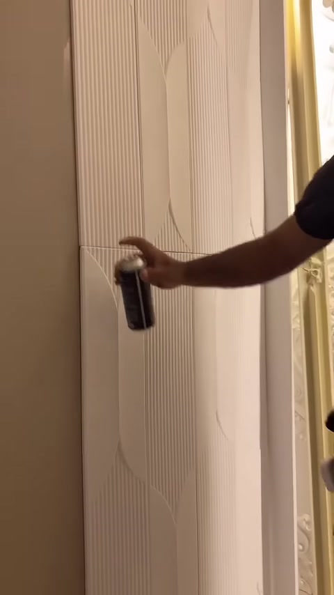 Fast-setting adhesive is sprayed into the joint between the raised lines.
