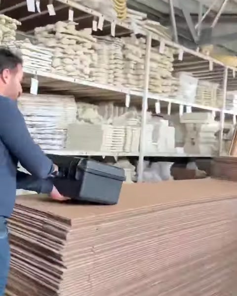 Workers move through shelves filled with architectural ornament pieces