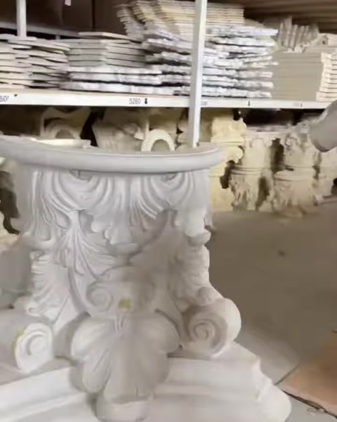 Close view of an ornate decorative capital among stored products