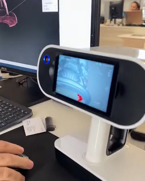 3D scanning equipment sits beside digital architectural modeling work