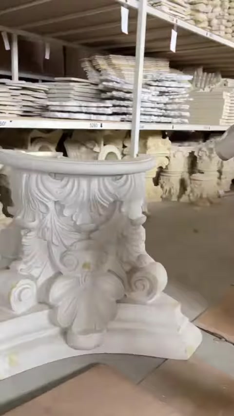 Close view of an ornate decorative capital among stored products