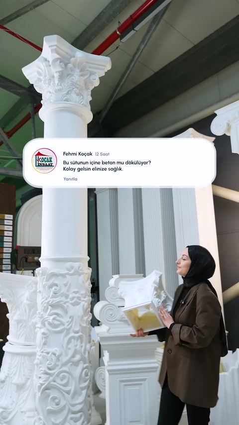 Presenter points to the column capital piece in his hand with his index finger