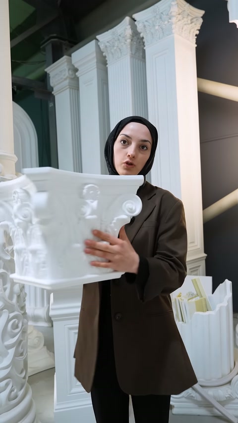 Interior of hollow column capital is seen closely with yellow foam filling