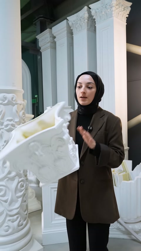 Yellow foam filling material inside column capital is shown in close-up
