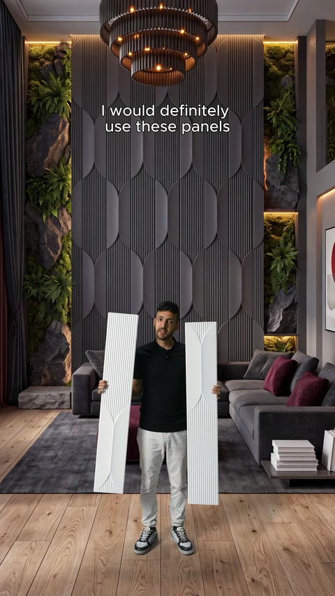 Presenter displays two long white decorative panels in a modern living room.