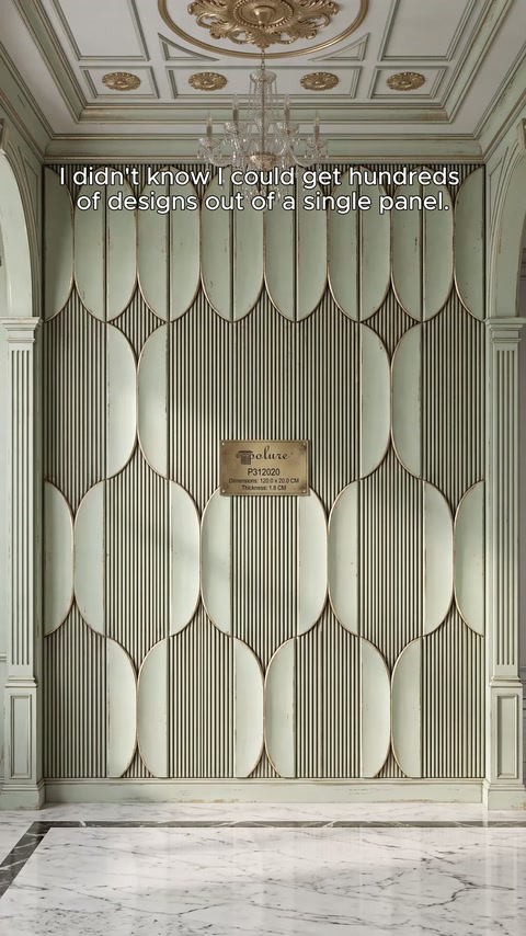 Cream-colored fluted panels creating oval patterns on a reception wall.