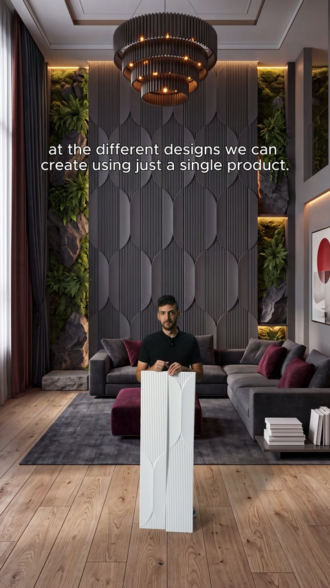 Presenter shows a panel section from the front in a grey geometric-clad room.