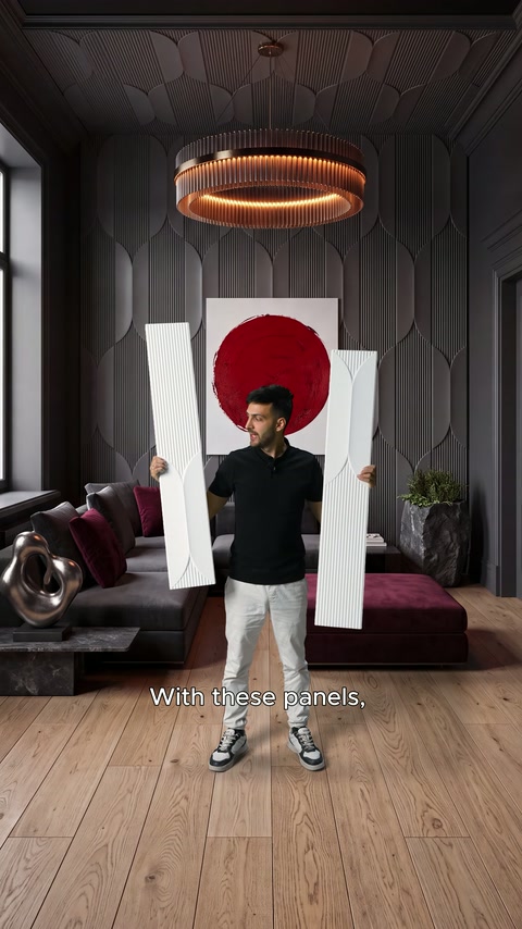 Presenter compares two sections in a seating area covered with dark panels.