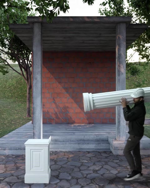 L'installatore solleva la colonna scanalata in poliuretano diagonalmente verso la base del piedistallo.