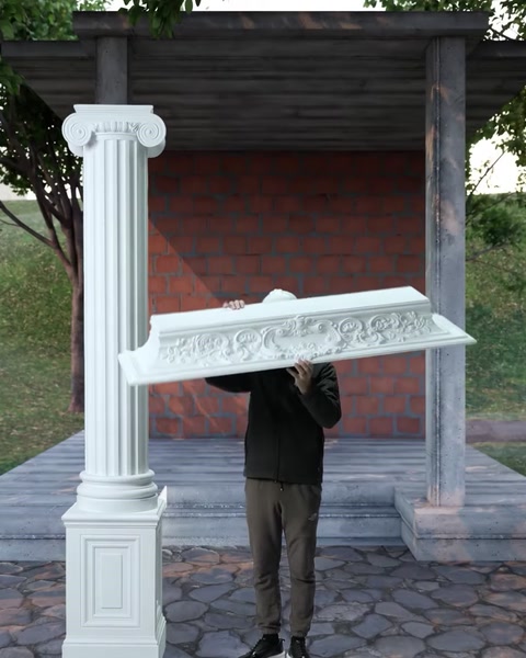 L'installatore solleva la cornice al di sopra della testa per posizionarla sulla colonna.