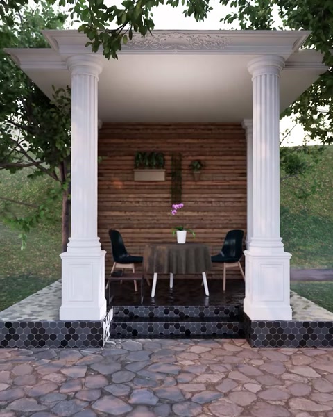 Una pergola completa con due colonne protegge lo spazio di seduta e il tavolo esterno.