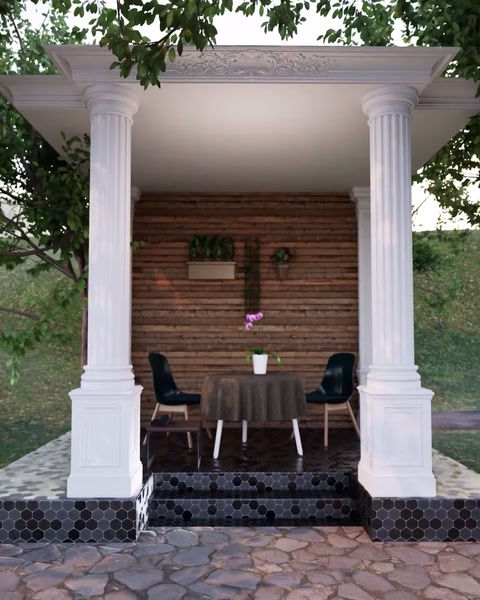 Pergola con colonne abbinate e tavolo da pranzo visto da un'angolazione diversa.