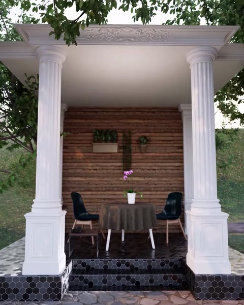 Pergola illuminata che mostra più colonne scanalate che supportano la trave del tetto.