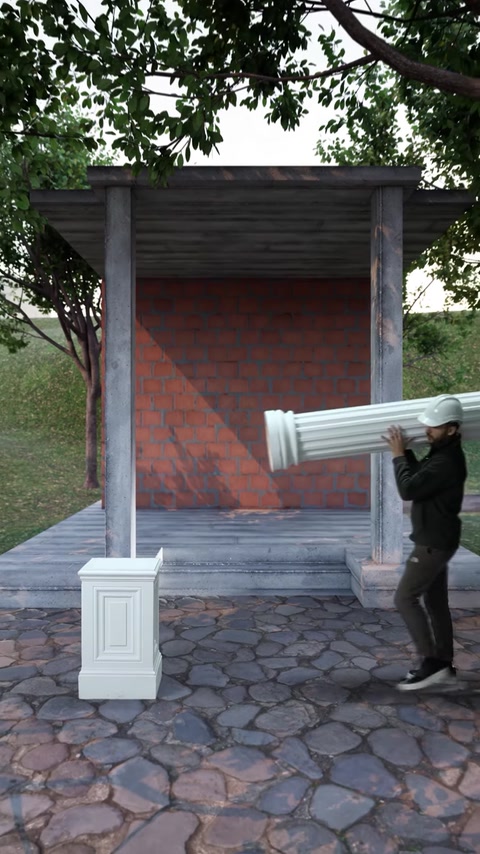 L'installatore solleva la colonna scanalata in poliuretano diagonalmente verso la base del piedistallo.