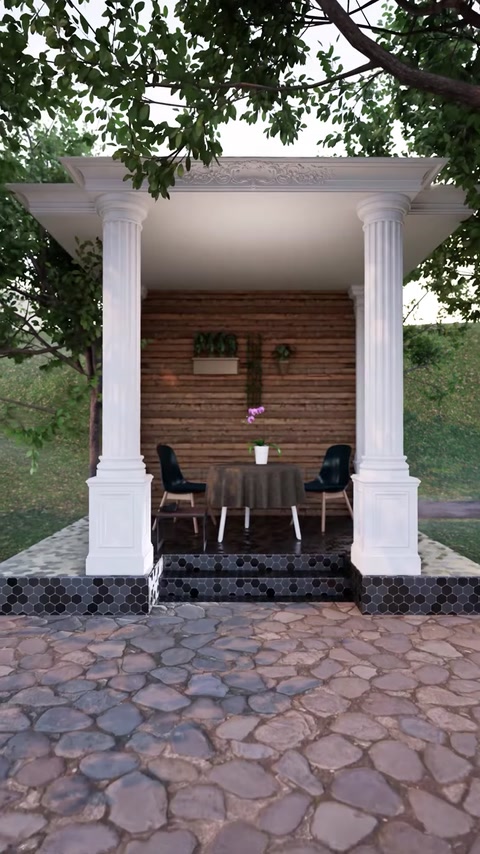 Una pergola completa con due colonne protegge lo spazio di seduta e il tavolo esterno.