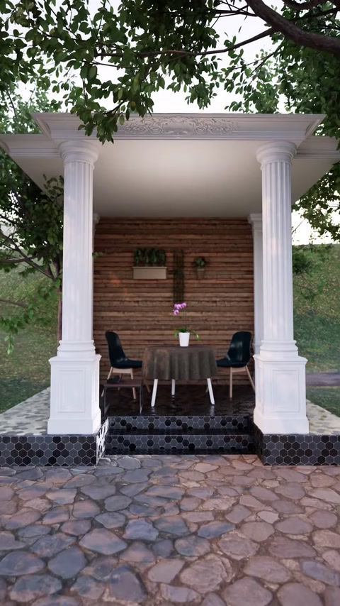 Pergola con colonne abbinate e tavolo da pranzo visto da un'angolazione diversa.