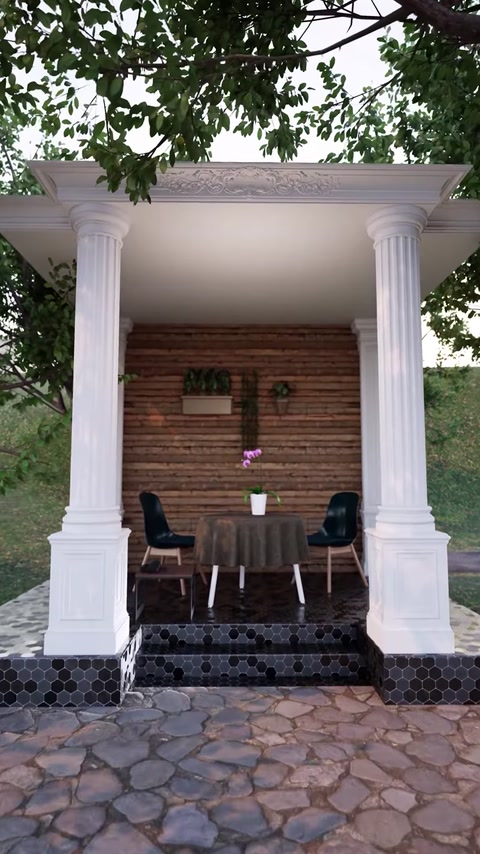Pergola illuminata che mostra più colonne scanalate che supportano la trave del tetto.