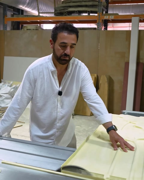 Manufacturer working on polyurethane panel at equipment