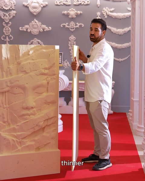 Manufacturer holding thinner 4-centimeter relief panel in hand
