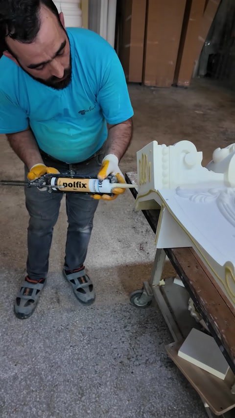 Pneumatic fastening tool secures a joint in the fireplace surround.