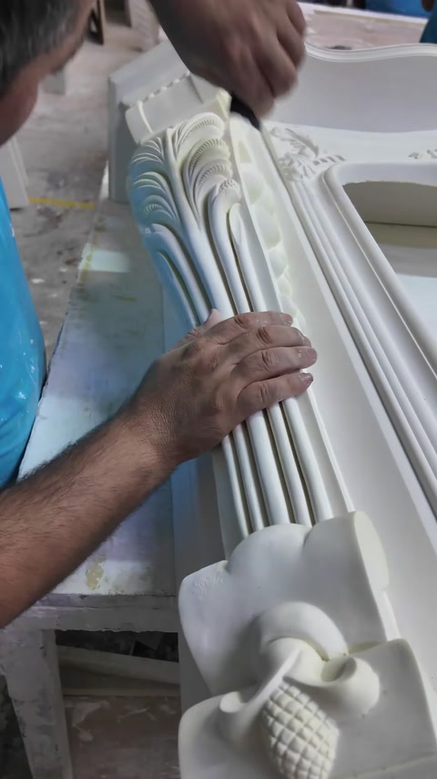 Fluted pilaster detail is carefully aligned against the fireplace frame.