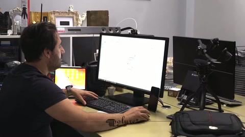 Design details of a window arch appear on the computer screen