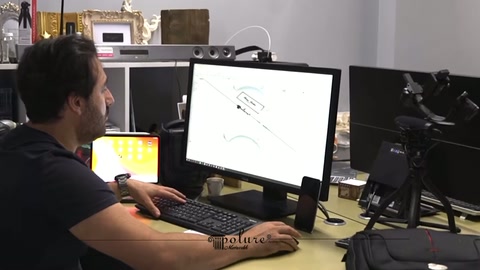 Designer shapes the lines of a curved surround model in the office environment