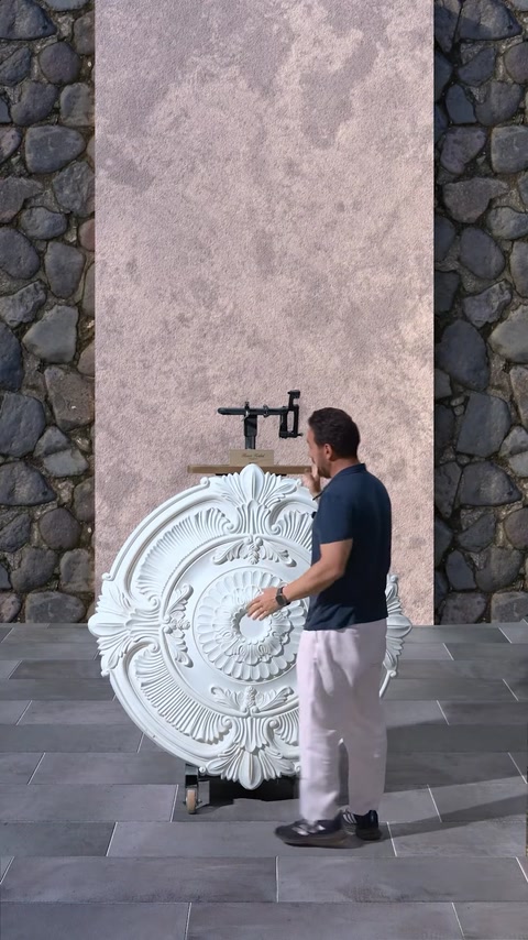 Circular ceiling medallion mounted on mockup wall for design