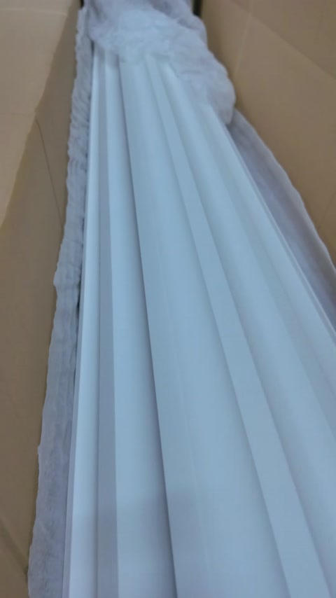 Thin decorative profiles are neatly arranged inside the box