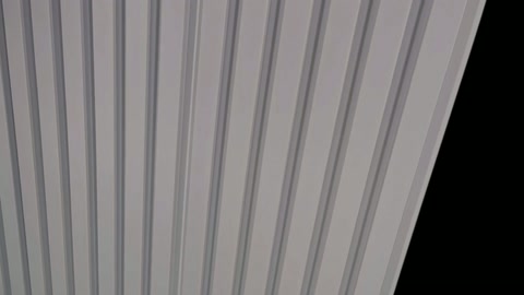 Vertical grooves and straight edge line are visible in close-up.