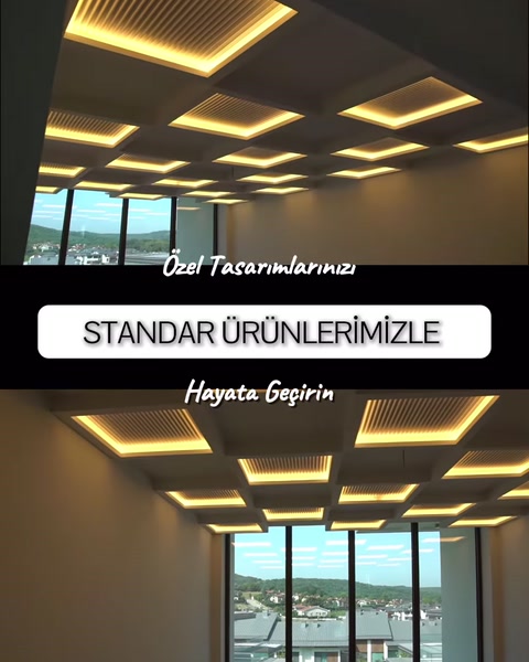 Tavan boyunca uzanan geometrik aydınlatma düzeni yandan görülüyor
