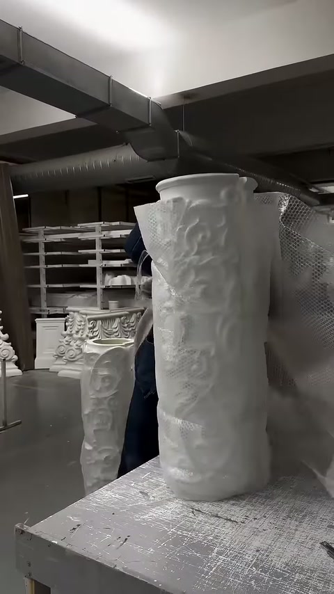 Embossed column body waiting for packaging at the workshop bench