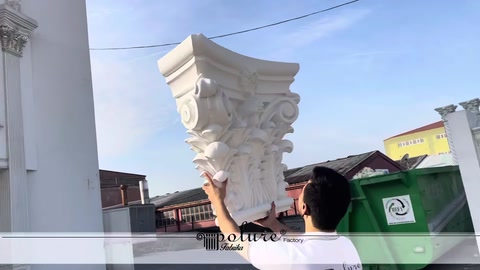 Wide upper profile of a white classical column capital