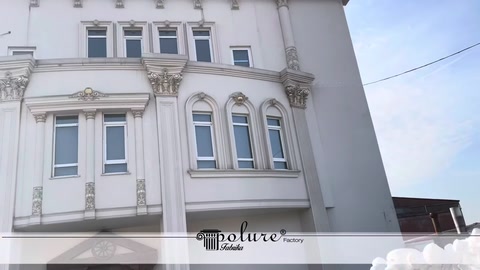 White building façade completed with classical decorative details