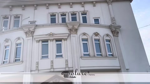 Decorative window-top ornaments and mouldings on the façade