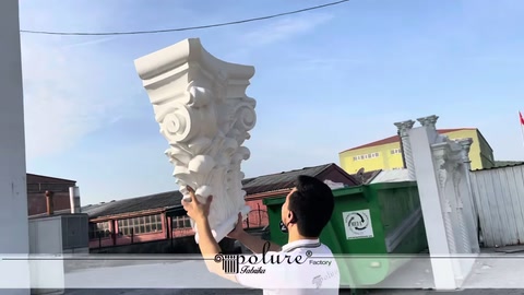 Staff member raising the decorative capital to reveal its lower section