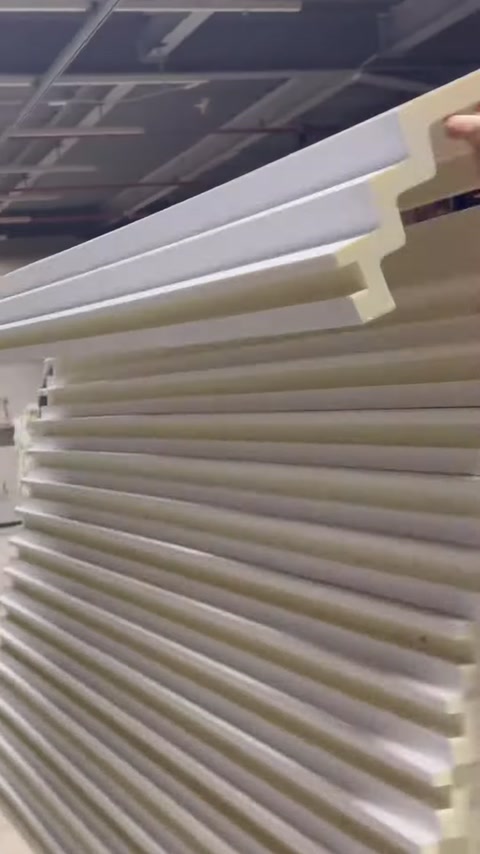 Long polyurethane profiles in different shapes are stacked on a rack.