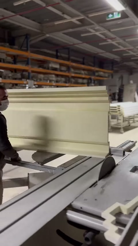 The decorative cornice is processed on the workbench with a circular cutter.