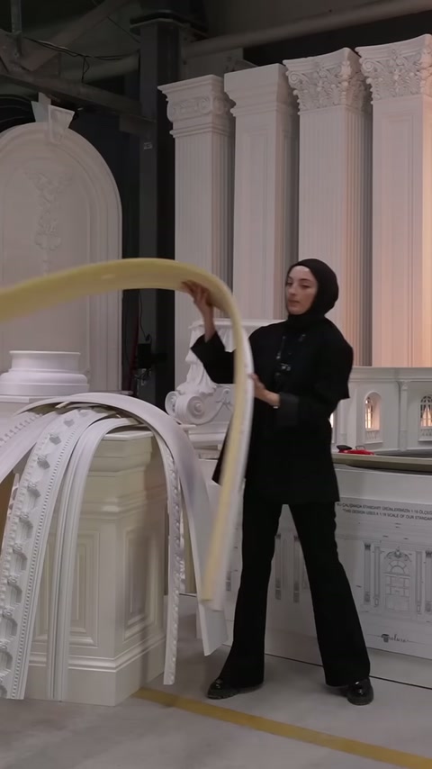 Yellow-backed flexible cornice is bent to form a wide arch