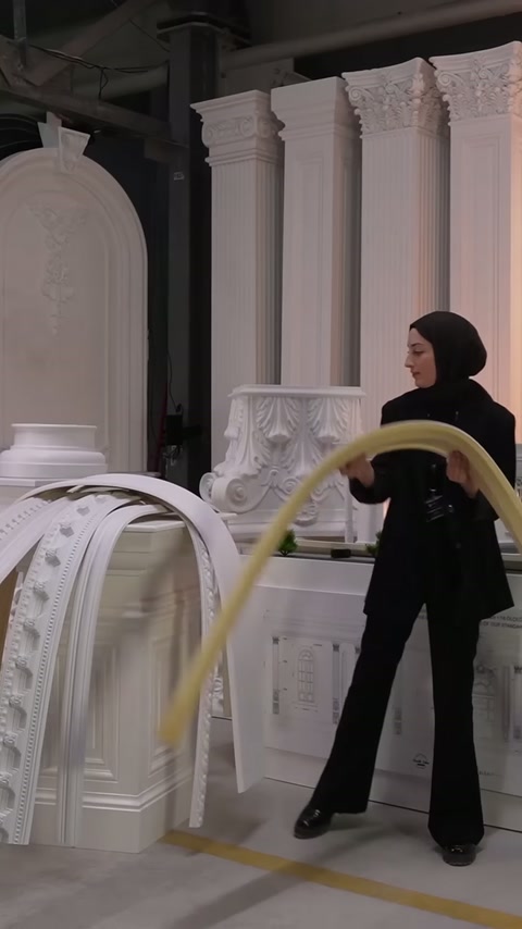Two ends of flexible cornice are brought together to show arched form