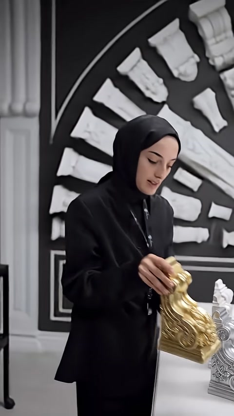 A gold-colored corbel is introduced in front of wall models