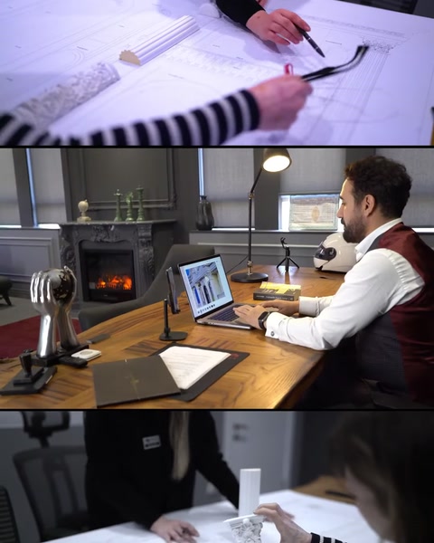 Architect working at desk with decorative fireplace visible nearby